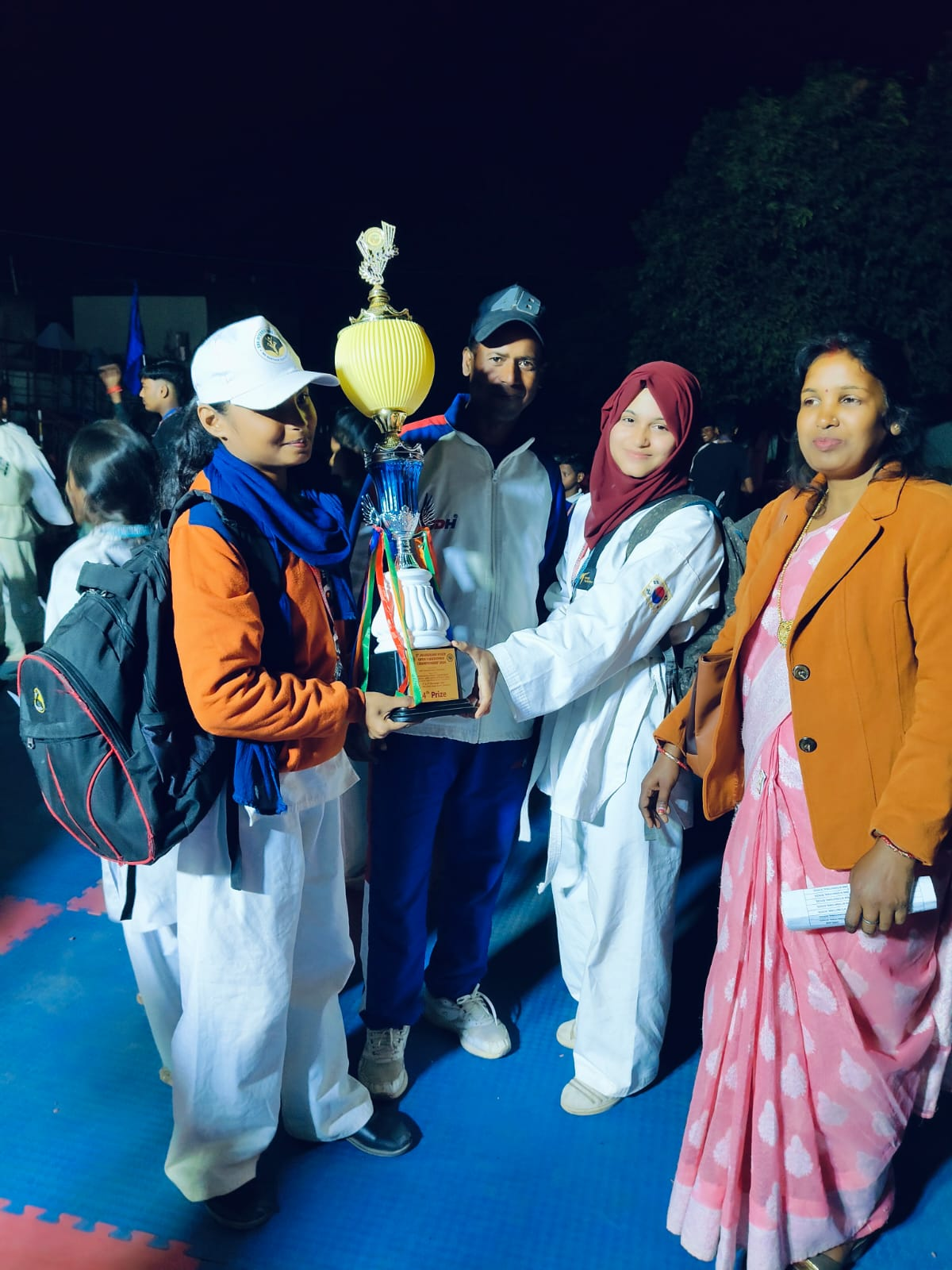 Taekwondo Champions with the Tournament Trophy